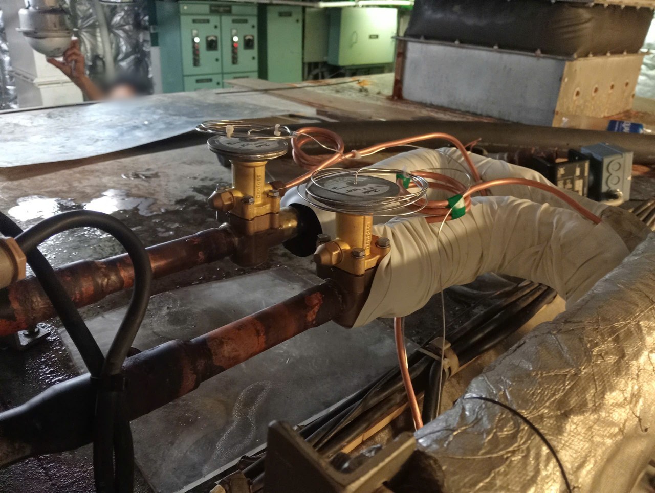 Two replacement expansion valves fitted on the central air-conditioning lines