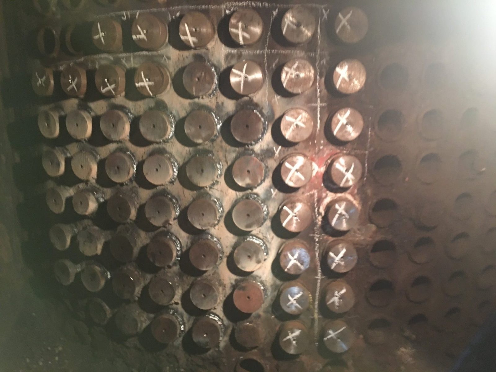 Boiler tube plate with marked tubes during temporary repair