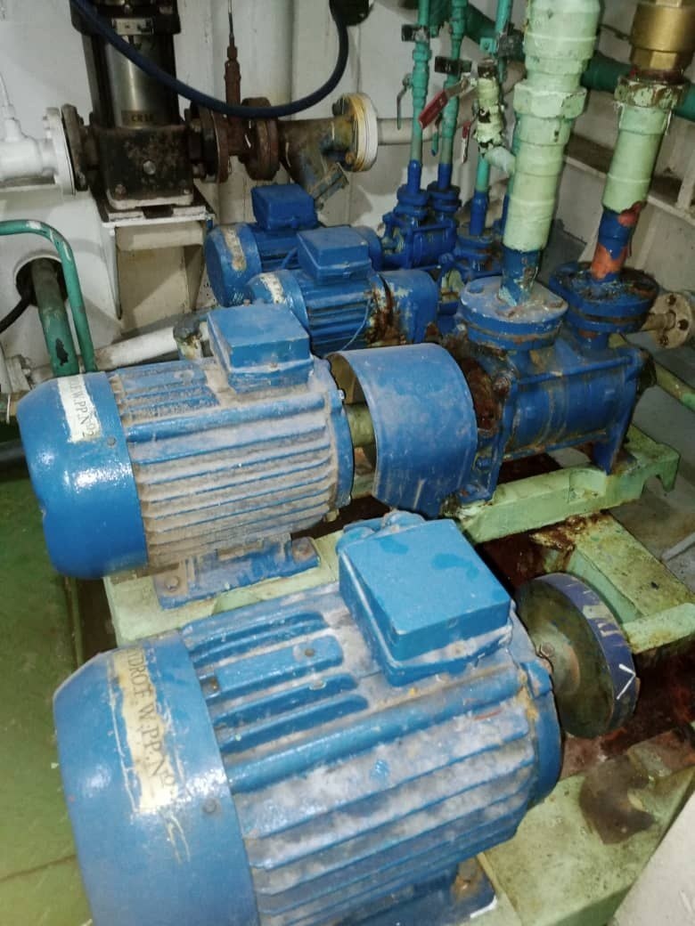 Cooling water pumps and motors in the engine room.