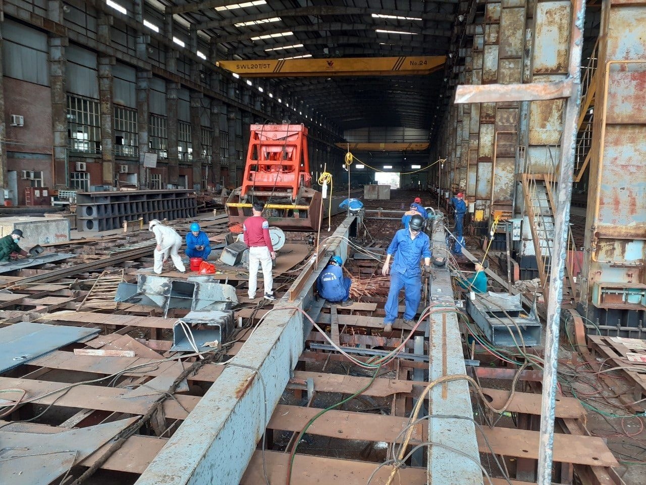Crane parts under repair in the workshop