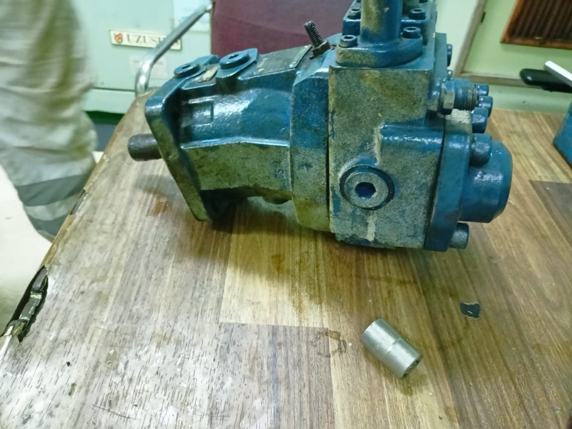 Deck crane hydraulic motor on the workbench for repair.