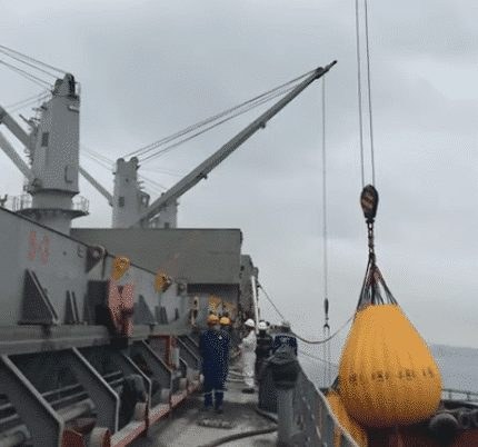 Water-bag load-test arrangement on a deck crane