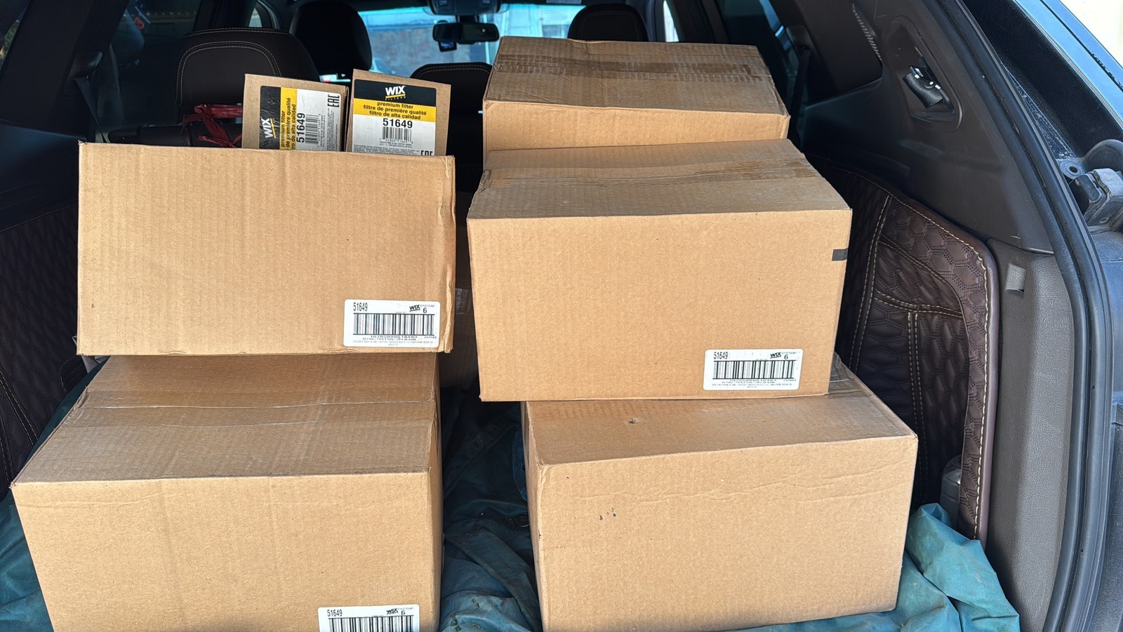 Cartons of engine filters packed for delivery to a vessel.