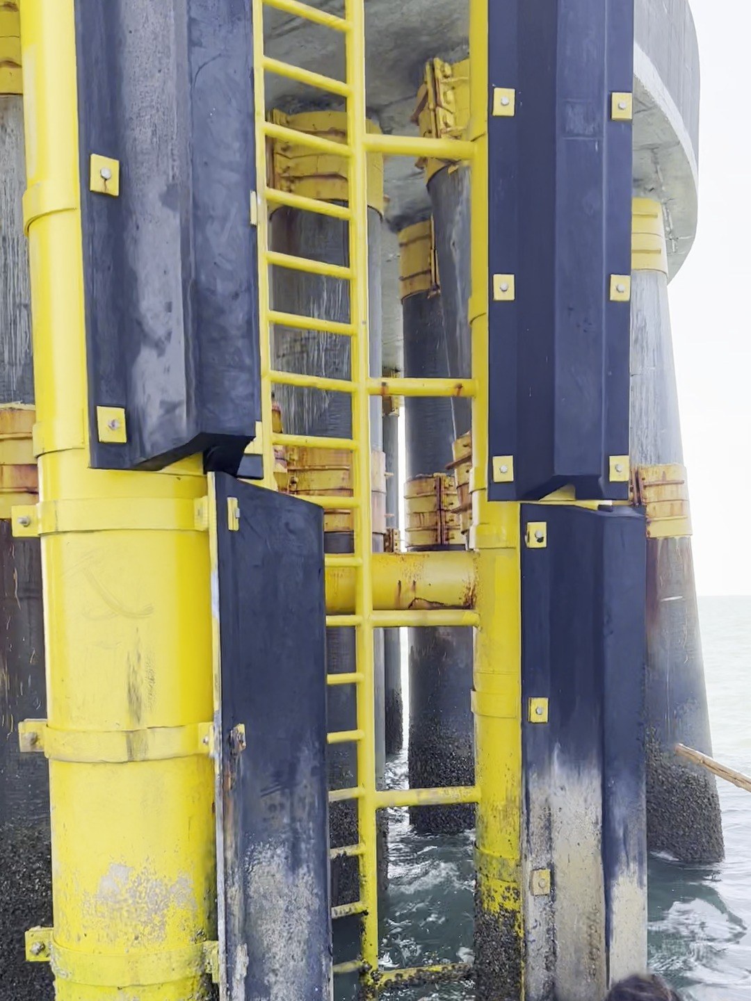 Foundation access ladder and boat-landing fenders