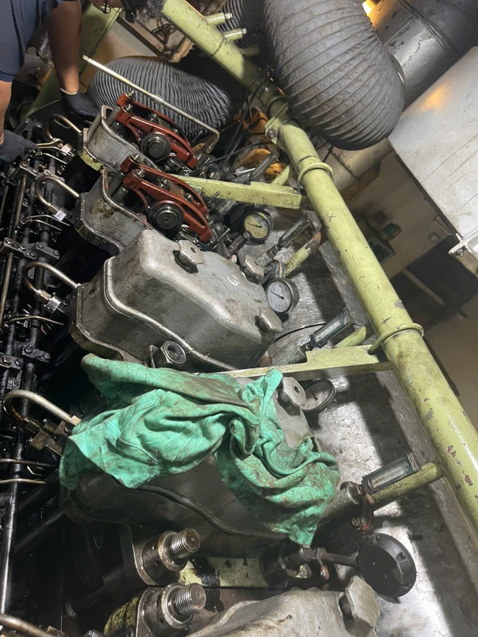 Auxiliary engine opened for access during fuel-pump work