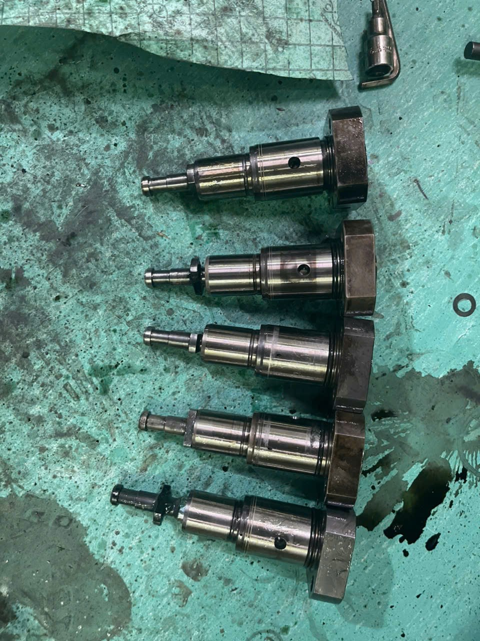 Fuel-pump plunger and barrel assemblies on the work surface