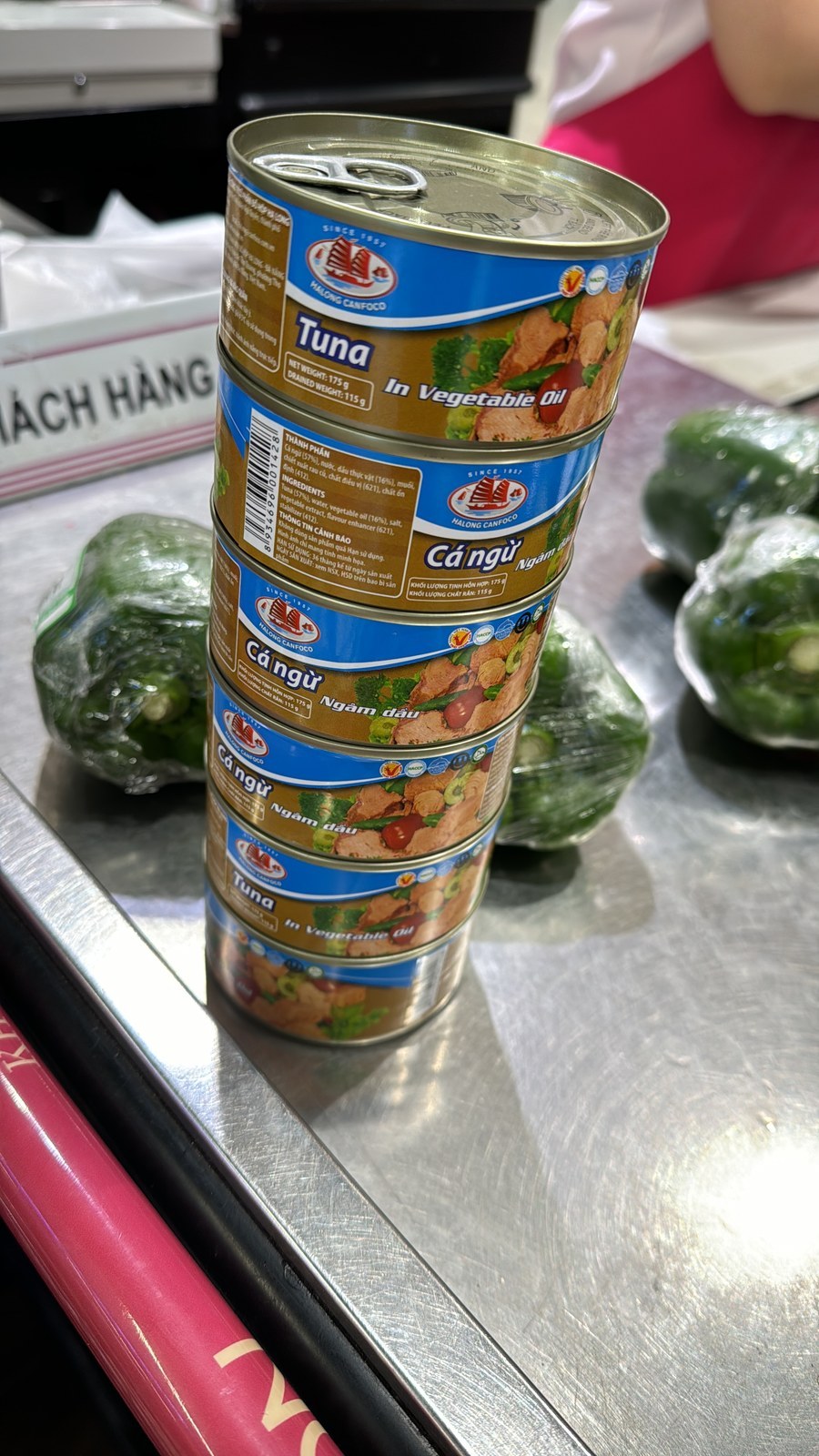 Canned tuna and fresh vegetables for galley replenishment.