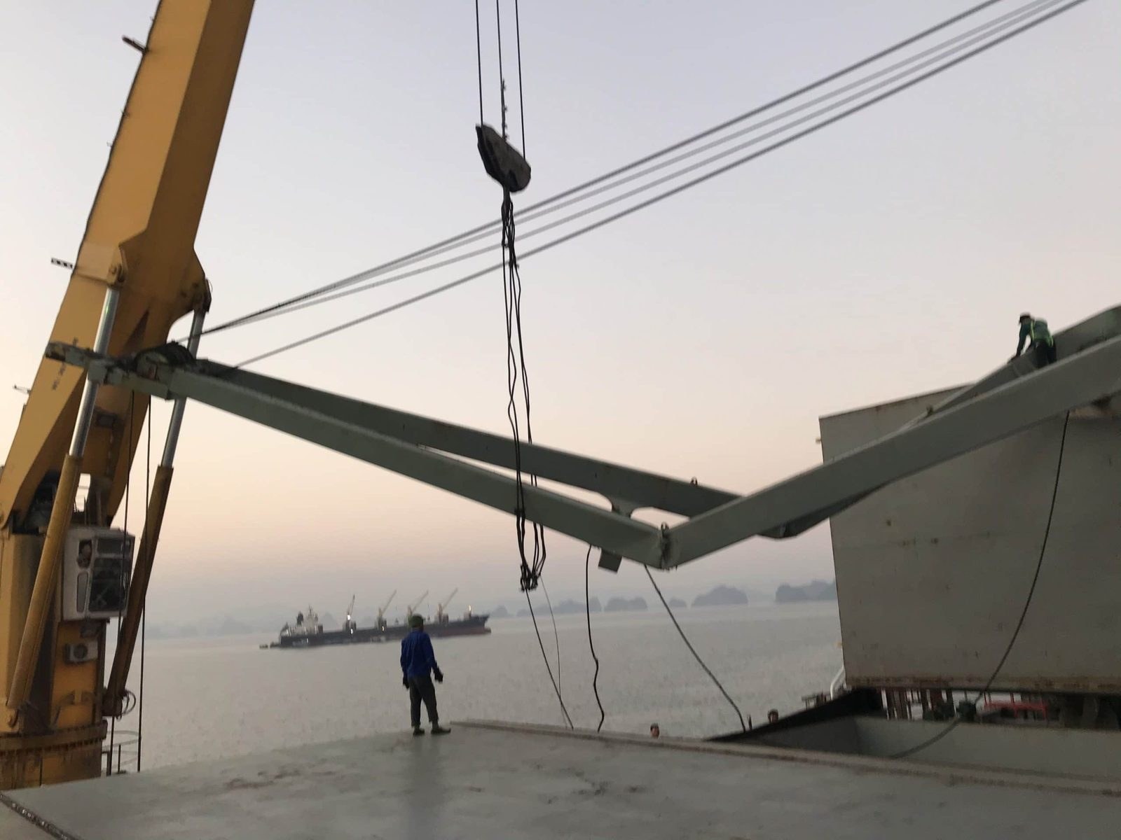 Jib crane boom lowered for repair at the anchorage