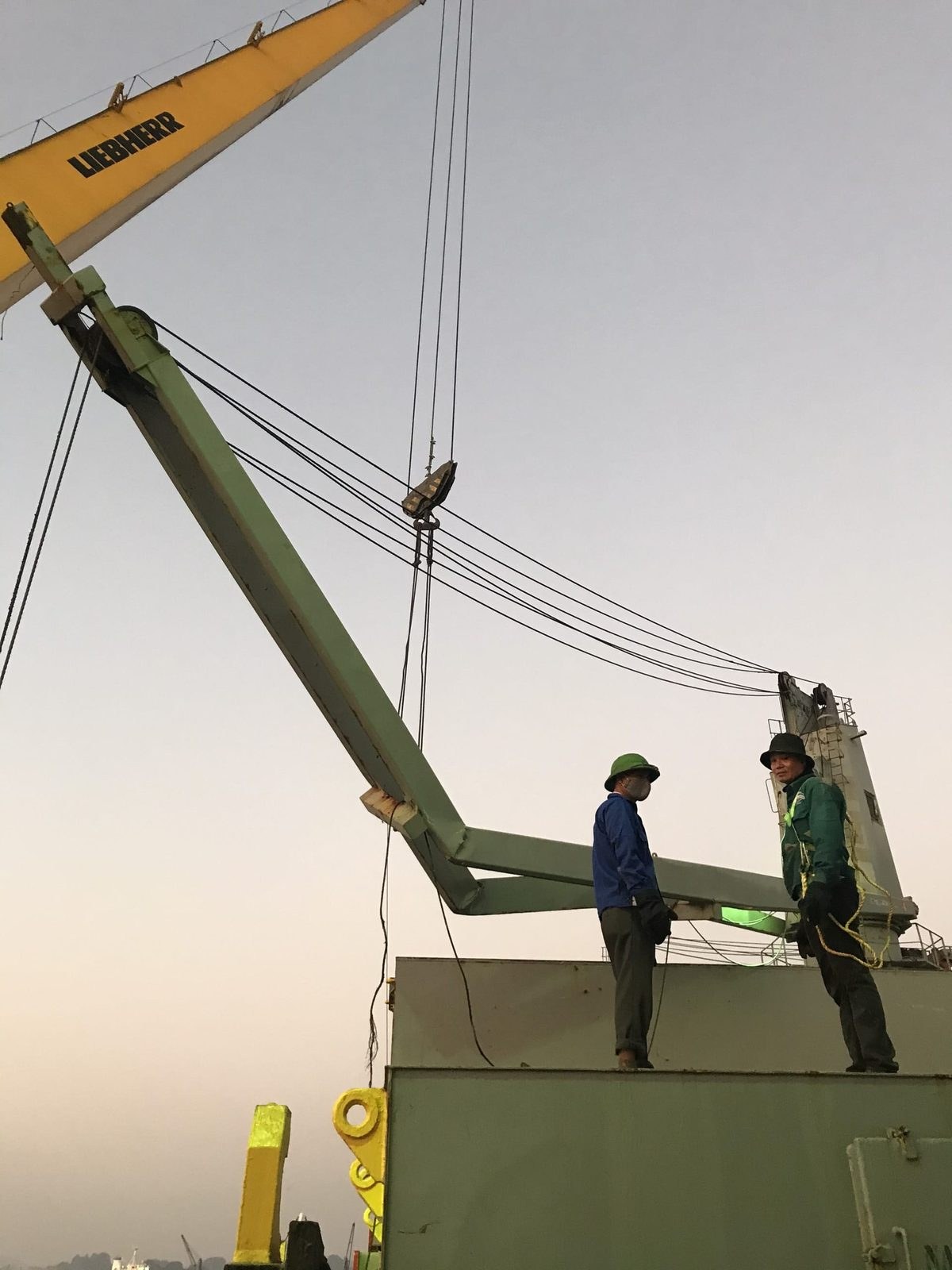Technicians at the jib crane boom