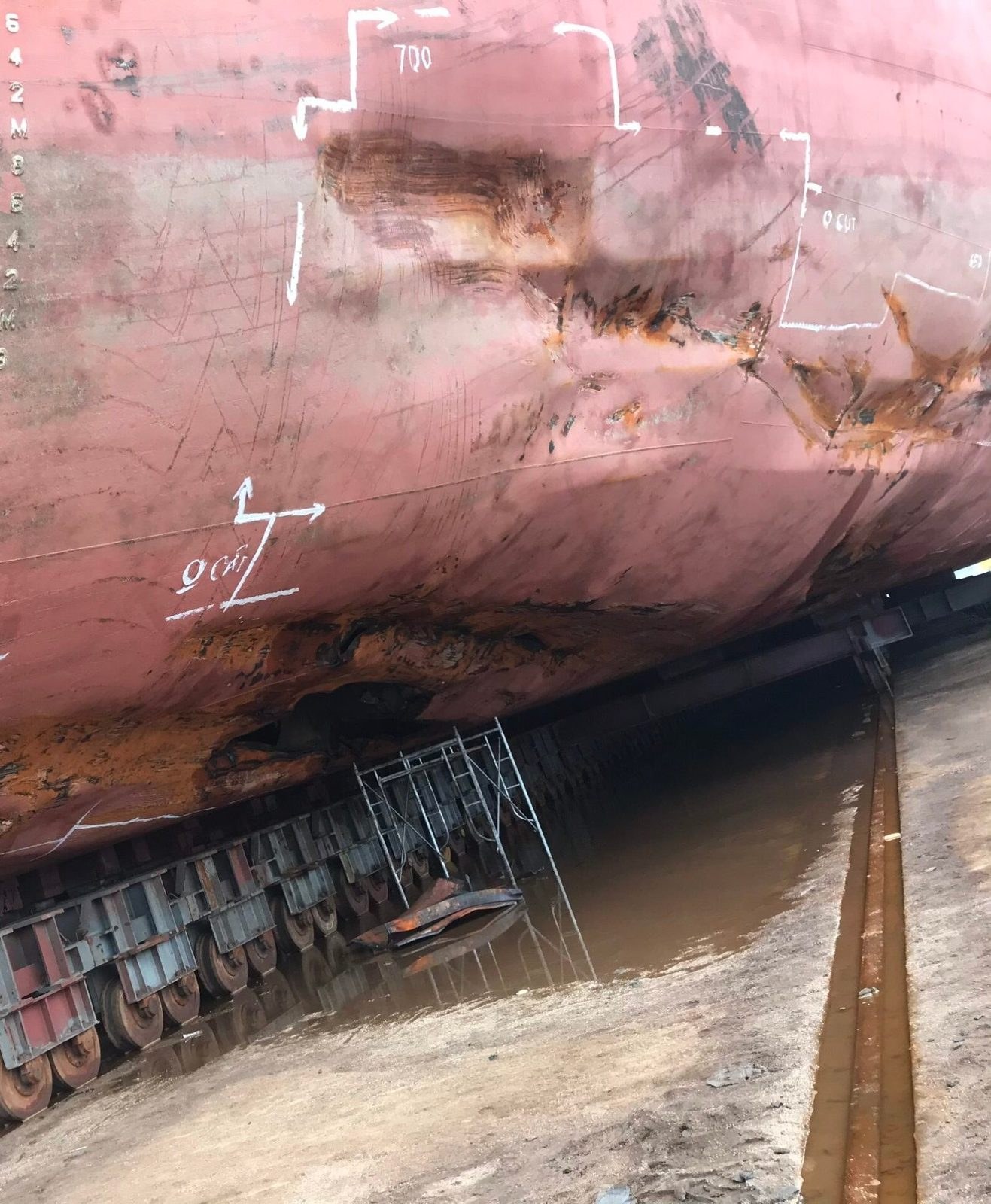 Marked hull damage at the keel area in dry dock