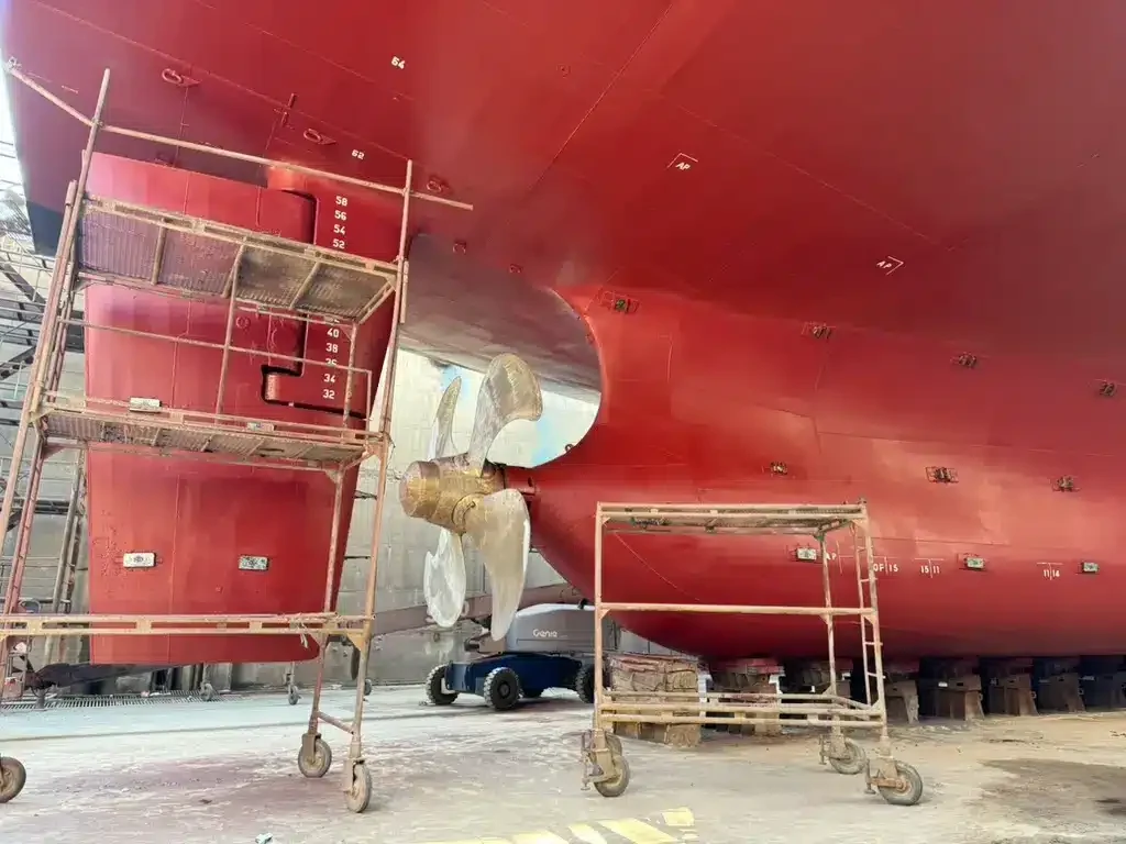 Coated underwater hull and propeller in drydock