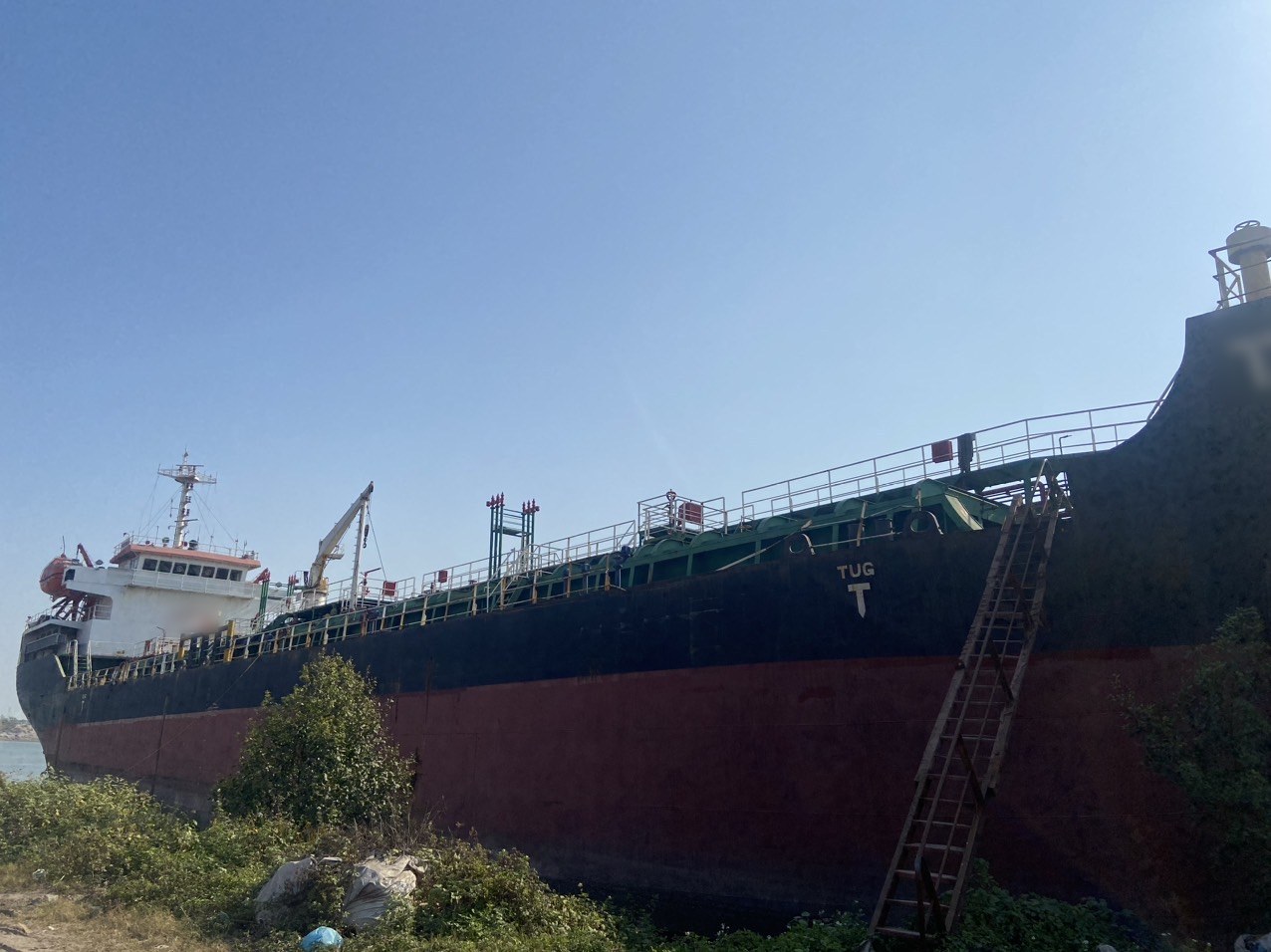 Laid-up oil tanker at the mud berth before recovery