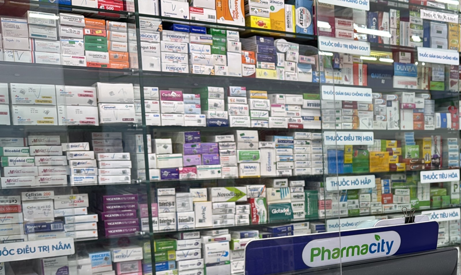Pharmacy shelves of packaged medicines for a ship medical-store order.