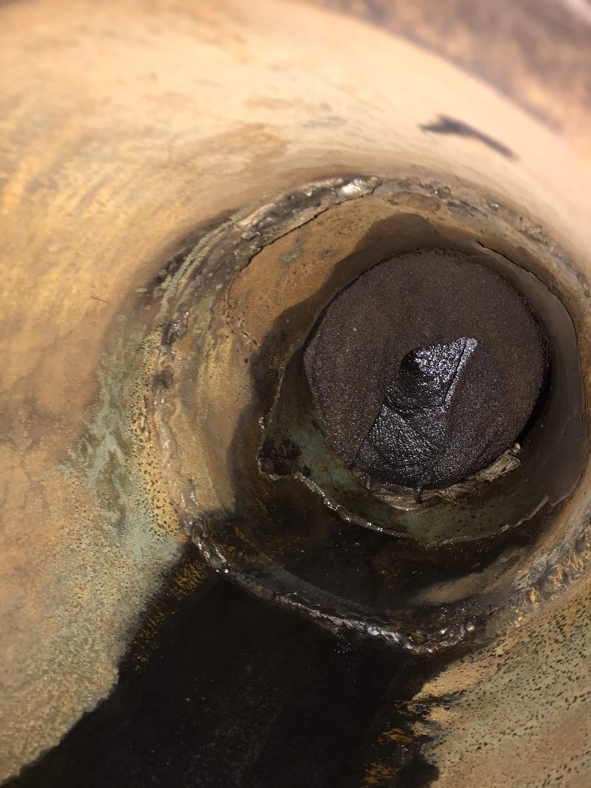 Corroded scrubber overboard pipe before repair