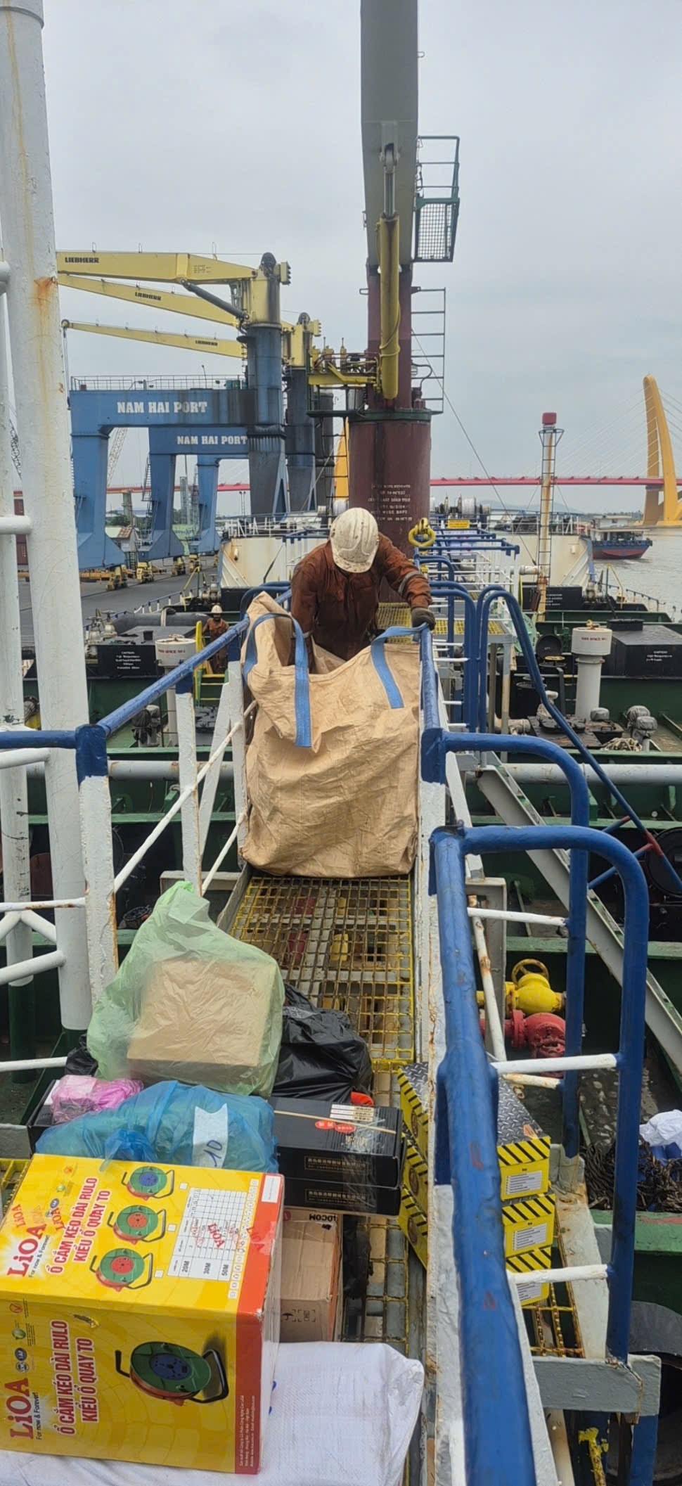 Crew moving packaged ship stores aboard