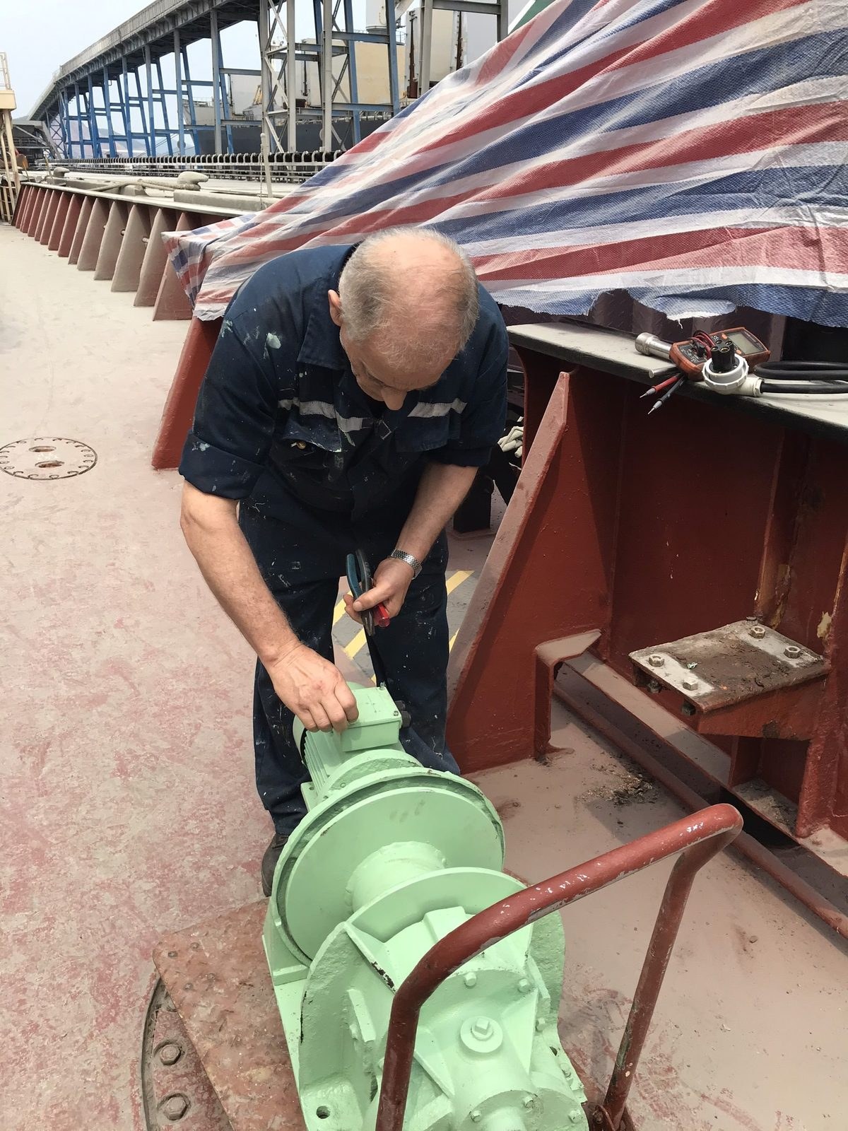 Technician checking used deck machinery