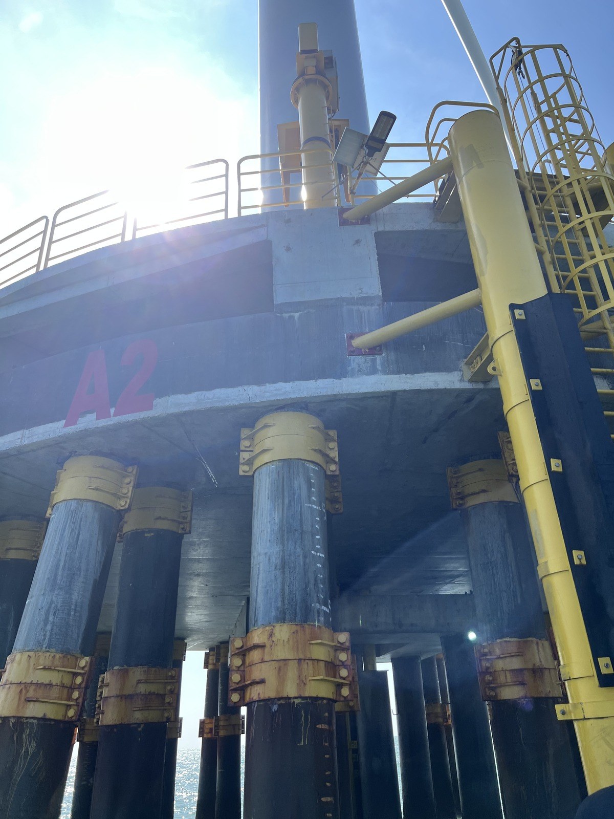 Wind turbine foundation platform with access ladder and piles