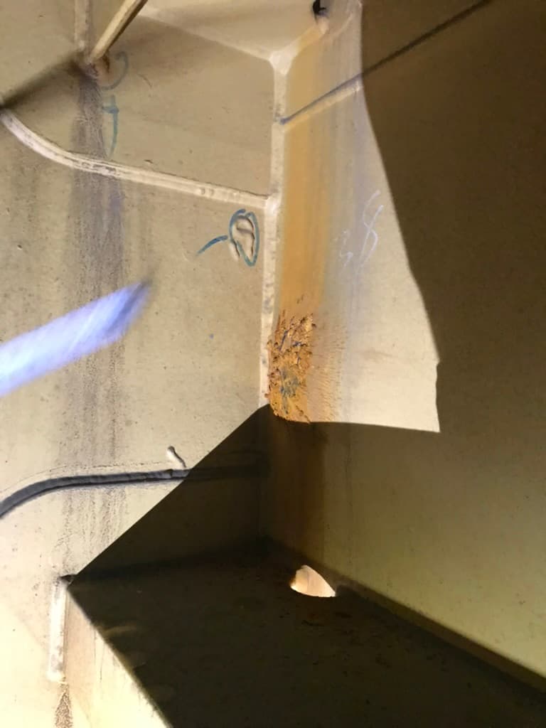 Wasted vessel steel with the repair boundary marked onboard before cropping